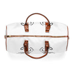 Top view of white weekender duffel bag with brown leather look handles, gold tone zipper, and black line art print