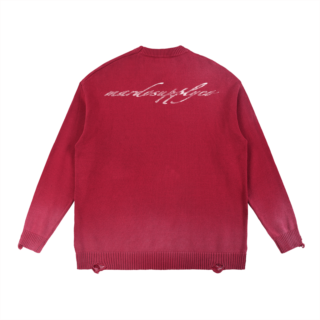 Back view of acid wash distressed red oversized sweater with mardosupplyco script print across upper back, streetwear cotton knit finish