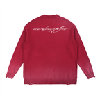 Back view of acid wash distressed red oversized sweater with mardosupplyco script print across upper back, streetwear cotton knit finish